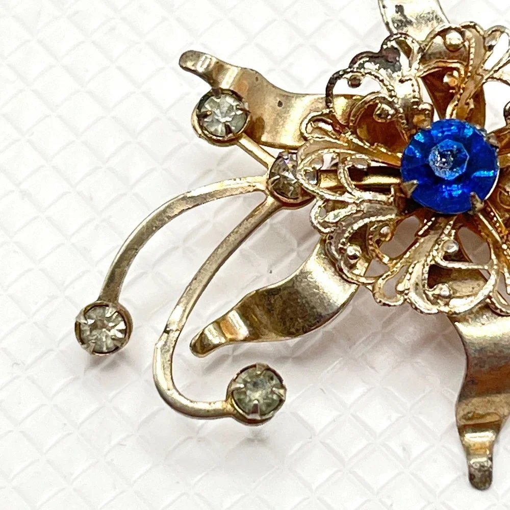 Vintage Gold Tone Flower Brooch w/ Blue and Clear Rhinestones
